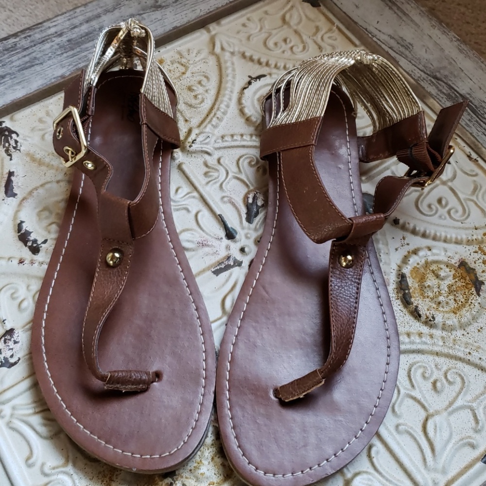 Brown t strap sandals with gold heel straps